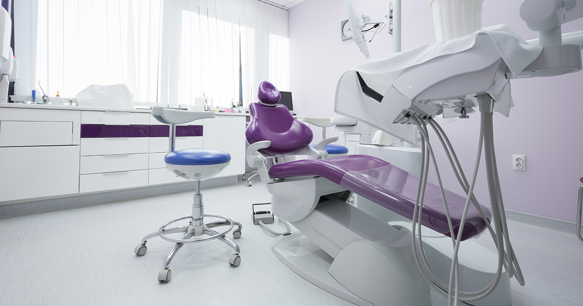 A patient chair in a dental practice operating room.